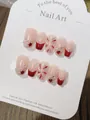 Detail of handmade red and white French press-on nails with 3D hearts and silver glitter - XS / C56 Fireworks Year After Year Short Coffin