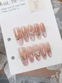 Macro view of pink gradient cat-eye press-on nails with butterfly and pearl charms - XS / Moonlight Silver Butterfly (Long Oval)