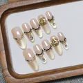 Handmade champagne cat-eye press-on nails with luxury crystals and French gold lines - XS / Ciphre Long Oval