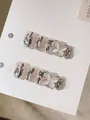Handmade light pink glitter press-on nails with silver metallic accents and 3D bows - XS / Super Short Trapezoid (063-Cat Eye Butterfly)
