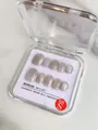 Detailed view of silver grey cat eye handmade press-on nails in size S packaging - XS