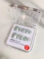 Detail of light green cat-eye press-on nails in an S-size square storage box - XS / Jade Green Cat Eye Short Square Round