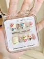 Detail of 10-piece handmade Y2K press-on nails with hearts and star patterns in a box - XS / Sweetheart Short Squoval
