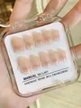 Handmade pink gradient press-on nails set with 10 pieces in a clear storage case - XS / Ultra Short Coffin (153) / 10 Pieces / Blush Pink Gradient