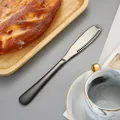 Couteau à beurre en acier inoxydable avec manche noir et trous pour le tartinage - Noir