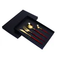 Golden titanium stainless steel cutlery set with red handles in a black gift box - Portuguese Red Gold - 4-Piece Set