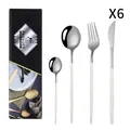 Ménagère 24 pièces en acier inoxydable avec manches blancs et boîte cadeau noire - Argent Blanc