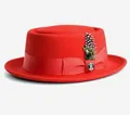 Detail of red wool felt pork pie hat with ribbon bow, textured feather and metal badge - 57cm / Red (Without Badge)