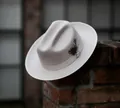 Classic ivory wool felt fedora hat featuring grosgrain ribbon and decorative feather detail - Beige With Beige Binding