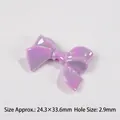 Macro detail of purple iridescent ribbon bow bead with 24.3x33.6mm size and 2.9mm hole - Purple