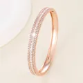 Detail of rose gold bracelet featuring three rows of zircon stones and side clasp - Rose Gold - White Zircon