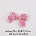 Detail view of pink bow resin bead with aurora finish and 2.9mm hole for DIY crafts - Size approx 24.3x33.6x7.8mm, Hole approx 2.9mm / Deep Pink