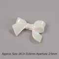 Detailed view of iridescent resin bow bead with measurements of 24.3x32.6mm for DIY jewelry - White