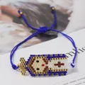 Detail of hand-woven blue Miyuki bead bracelet with Virgin Mary cartoon motif - Blue