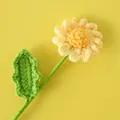 Macro detail showing hand-knitted yellow daisy flower with fine crochet craftsmanship - Yellow