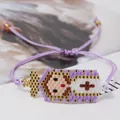 Close-up of handmade Miyuki bead bracelet with Virgin Mary pattern and adjustable purple cord - Light Purple