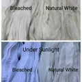 Cheesecloth table runner in bleached and natural white shown in sunlight - 90x180cm / Off-White