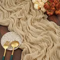 Beige cheesecloth table runner with natural crinkle texture on a wooden wedding table - 90x180cm / Deep Beige