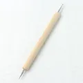 Macro detail of dual-head metal dotting tool with natural wood handle for nail art design - Double Ended Wooden Dotting Pen