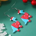 Blaue Acryl-Weihnachtsdinosaurier-Ohrringe mit Nikolausmütze und Stiefeln auf grünem Grund - Azurblauer Weihnachtsmannhut Dinosaurier