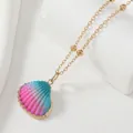 Detail of gradient seashell pendant necklace with golden bead chain and refined metal edges - Multi-color/KC Gold
