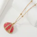 Deep red shell pendant necklace with gold ribbed finish on a delicate satellite chain - Magenta Gold