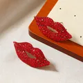 Sparkling red rhinestone lip earrings with gold plating in a vintage long drop design - Red