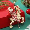 Broche de Noël dorée avec Père Noël sur renne en émail rouge et strass brillants - Santa Riding Deer Red (BR1652)