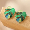 Elegant gold-plated Monstera leaf earrings with green enamel coating for women - Green