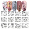 Set of 12 floral and butterfly nail art water decals shown on various nail tips - Black Line Mandala Style (BN1189-1200)