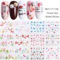 Close-up of flower water transfer nail art stickers with mixed floral patterns and text - BN1117-1128