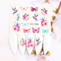 Detail of floral butterfly nail art stickers on long white almond-shaped nails - Watercolor Butterfly and Hummingbird (STZ-988)