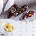 Décorations nail art de Noël avec rennes et flocons dorés en flacons pour manucure - Doré