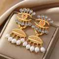 Boucles d'oreilles élégantes avec perles, œil en cristal bleu et accents dorés - Evil Eye Blue Sapphire Style