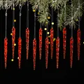 Set di 12 decorazioni natalizie in acrilico rosso trasparente a forma di ghiacciolo su rami - Rosso