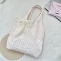 Detailed view of large white lace bow on a pink polka dot canvas shoulder bag for women - Pink Polka Dot Vest Bag With Apricot Flower