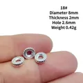 8mm silver alloy flower spacer bead for DIY jewelry with 2.6mm hole shown on fingertip - 18#