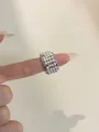 Detail of vintage square woven ring featuring four rows of white pearls on silver band - Wide Pearl Style