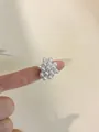 Detail of vintage square pearl ring cluster on a finger with silver glitter nails - Pearl Flower