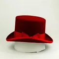 Classic red wool felt top hat for women with elegant ribbon bow decoration on a stand - Red