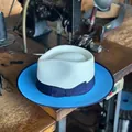 Two-tone wool and straw fedora hat with blue brim and ribbon on a vintage table - Dark Blue Ribbon Bow Style / White And Light Blue