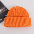Bright orange knit beanie cap in a warm ribbed texture for autumn and winter wear - Adult / Orange