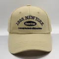 Detailed macro of the blue 1989 New York embroidery on this khaki cotton baseball cap - M (56-58cm) / Khaki