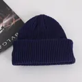 Solid deep blue ribbed knit beanie hat with wide fold-over cuff for winter warmth - Adult / Navy Blue