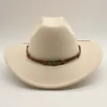 Detail of western cowboy hat featuring a skull metal buckle and brown braided band - M (56-58cm) / Off White
