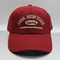 Deep red cotton baseball cap featuring 1989 New York embroidery and stitched visor - M (56-58cm) / Red
