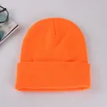 Bright orange cuffed knit beanie hat with vertical ribbed texture for winter warmth - Bright Orange