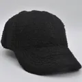 Detail of black faux lamb wool fabric on children's baseball cap for winter warmth - 52-54cm / Black