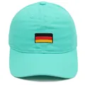 Mint green cotton baseball cap featuring German flag embroidery and 6-panel design - Emerald Green