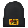 Black knit beanie with yellow patch featuring Have a Nice Day text and floral embroidery - Adult - Adjustable / Black